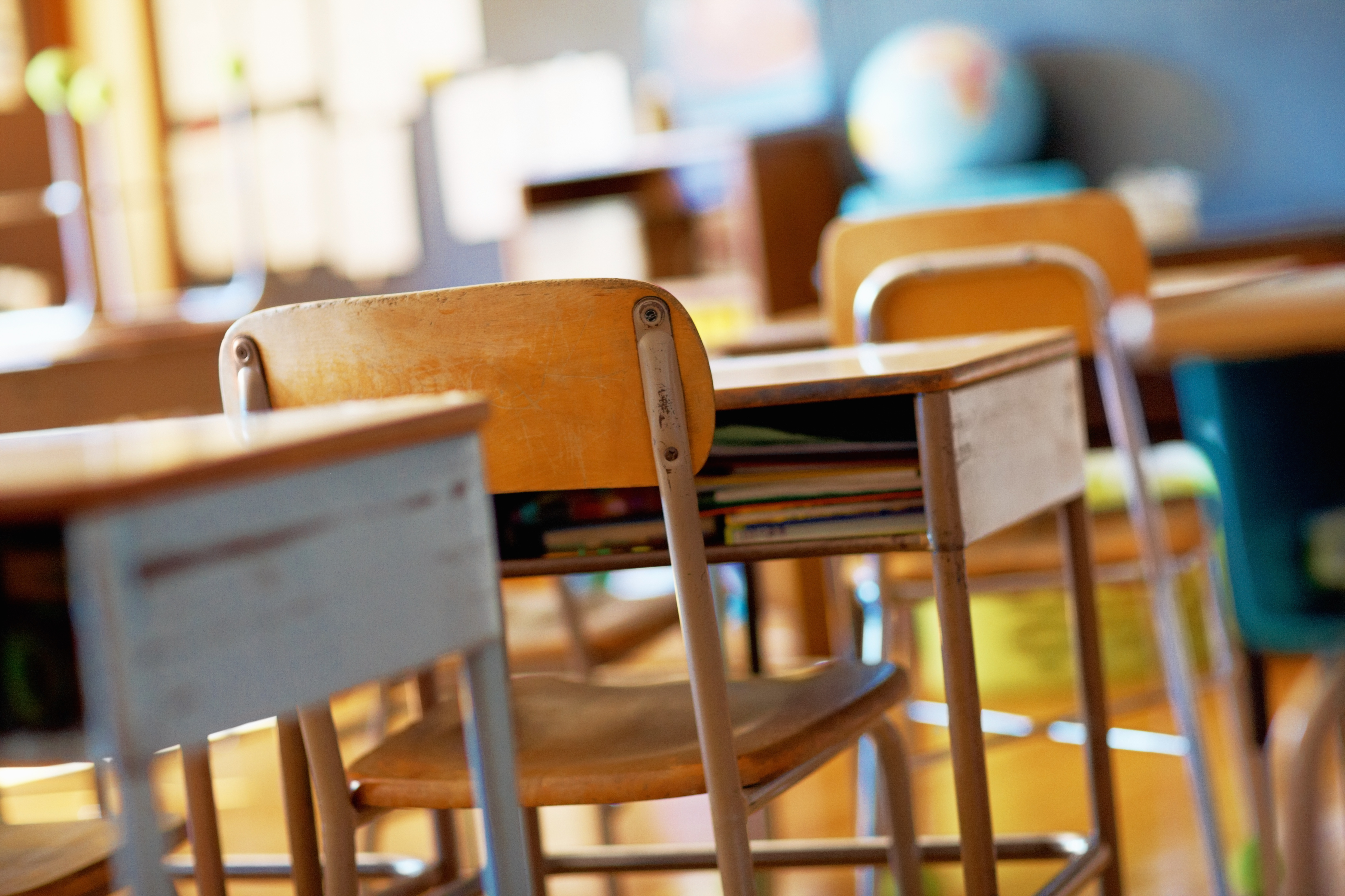 Classroom with empty wooden desks